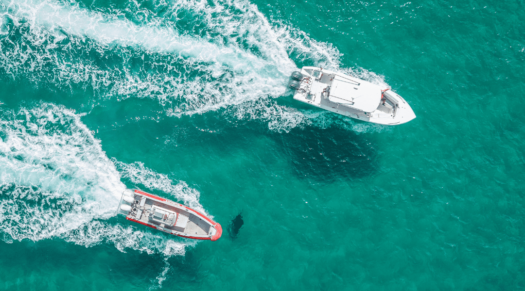 Manta rays in Florida are often seen with injuries from boat strikes. Here you can see two boats pass closely to a manta at the surface.